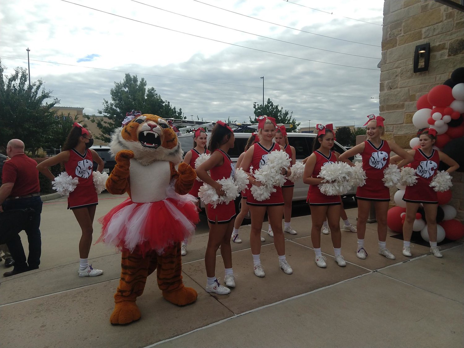 The Katy Tiger cheer squad jazzes up the crowd at the ribbon cutting for Old Chicago Pizza & Taproom on Oct. 11. The ceremony was just one part of SPB Hospitality’s big news for the Katy area after it opted to move its corporate office from Denver, Col. to Texas which will bring hundreds of jobs to the community.